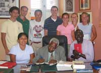 In Martinique with Csaire -- standing from left, Andrew Robb, Patrick Ottenhoff, Stefan Hasegawa, Michael Wentz, Robyn Ross, Kerry Golcher and Julia Dunfey. Seated from left, Yadira Briones, Csaire and Prof. Cheikh Ndiaye.
