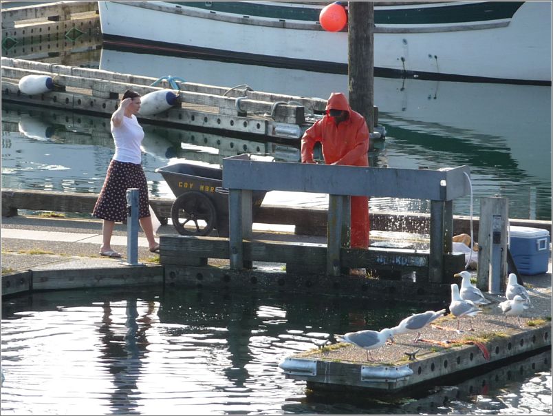 Cleaning fish; fighting off gulls